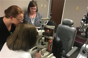 Doctor examining student in Low Vision clinic 